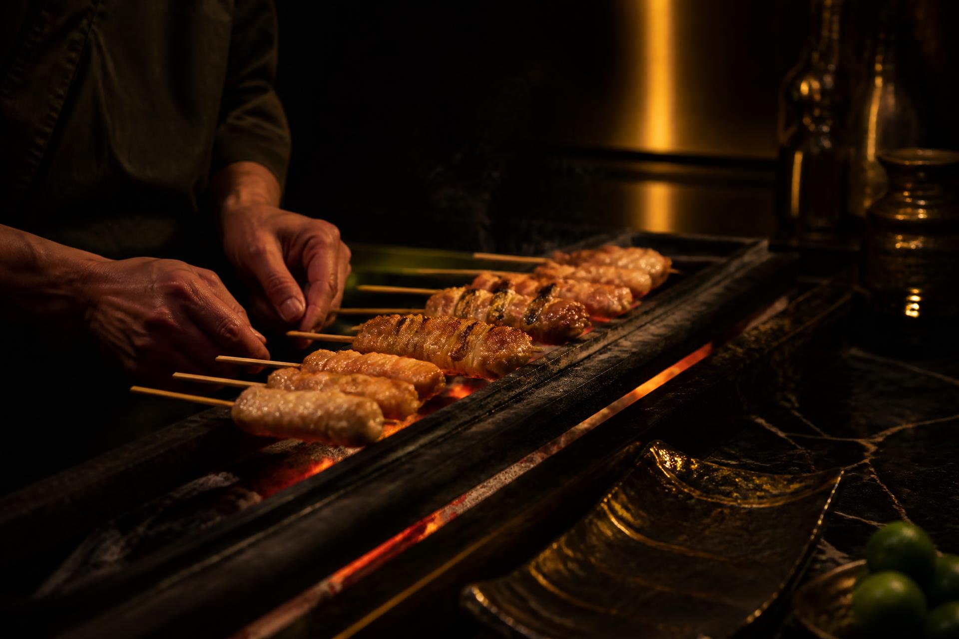 Yakitori skewers cooking over binchotan embers